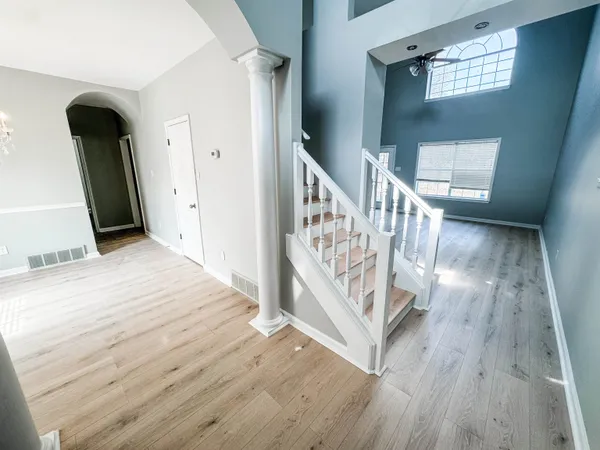 a view of entryway with wooden floor
