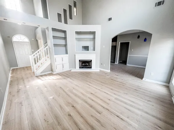 a view of a livingroom with wooden floor