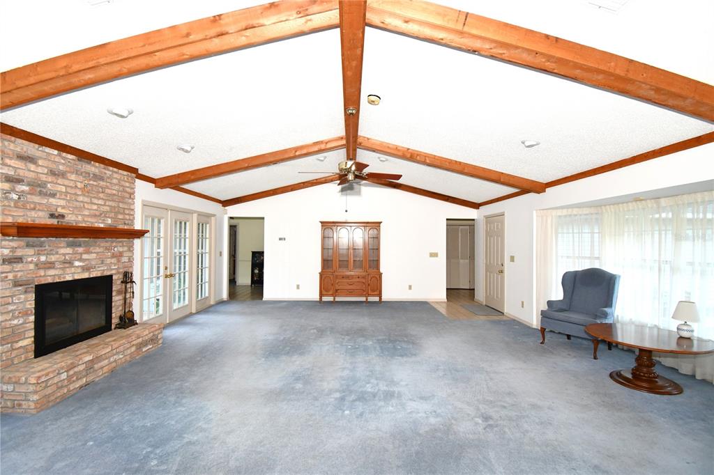 611 Old Eustis Road Mount Dora, FL 32757 - Photo 16 of 45 a view of a livingroom with furniture and a fireplace