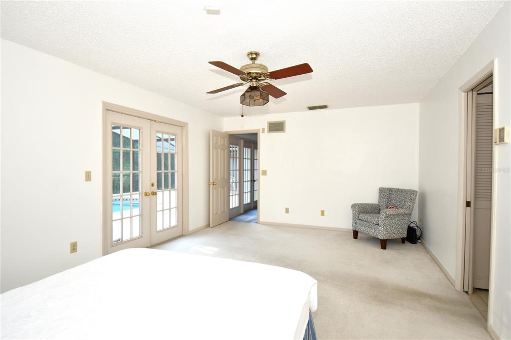 611 Old Eustis Road Mount Dora, FL 32757 - Photo 22 of 45 a bedroom with a bed and furniture