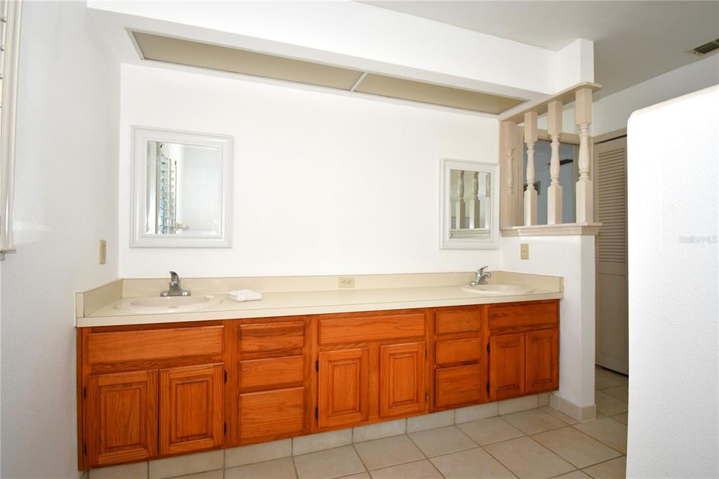 611 Old Eustis Road Mount Dora, FL 32757 - Photo 25 of 45 a bathroom with a granite countertop sink mirror and