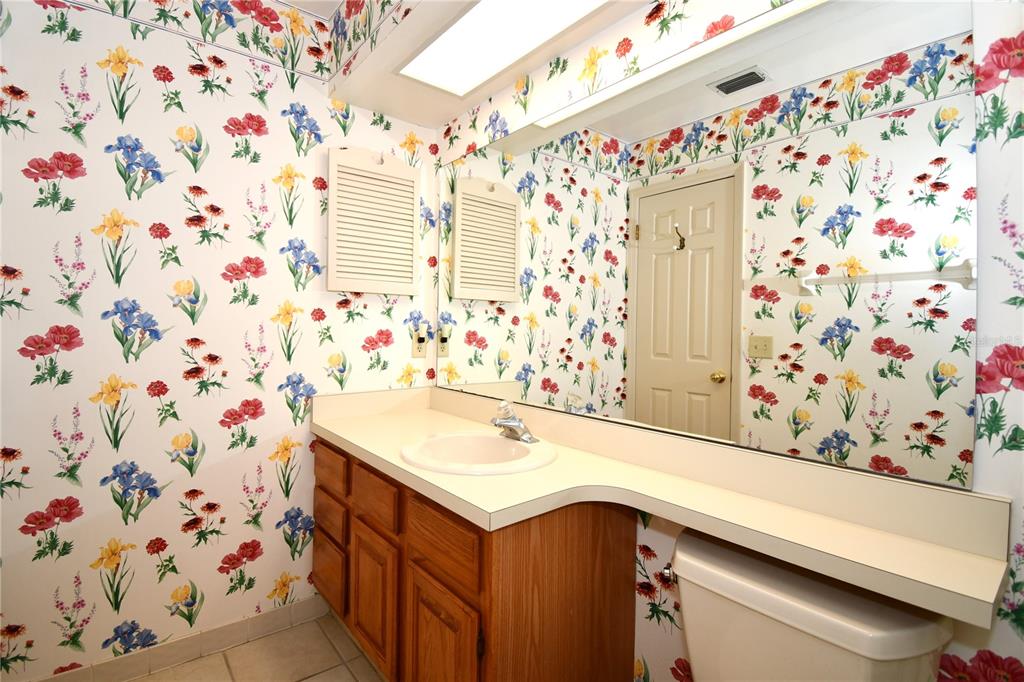 611 Old Eustis Road Mount Dora, FL 32757 - Photo 30 of 45 a bathroom with a sink and a shower curtain