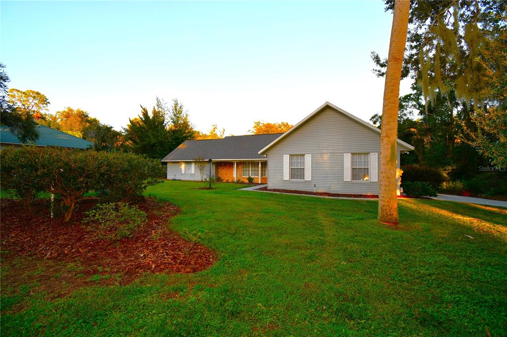 611 Old Eustis Road Mount Dora, FL 32757 - Photo 3 of 45 a view of a house with backyard and garden