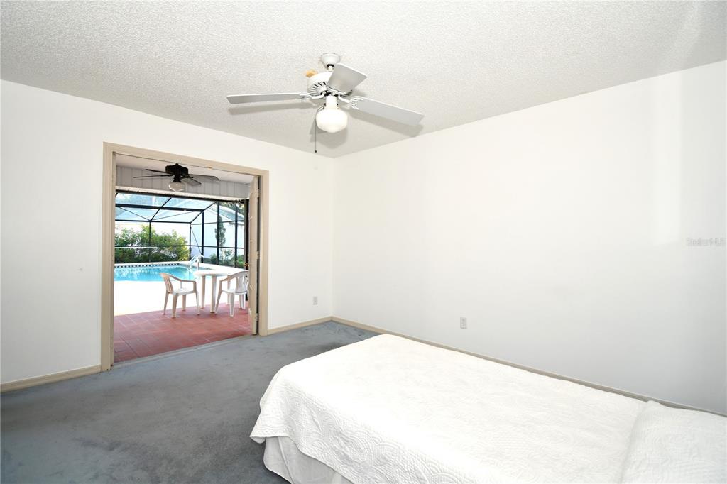 611 Old Eustis Road Mount Dora, FL 32757 - Photo 32 of 45 a bedroom with a bed and a window