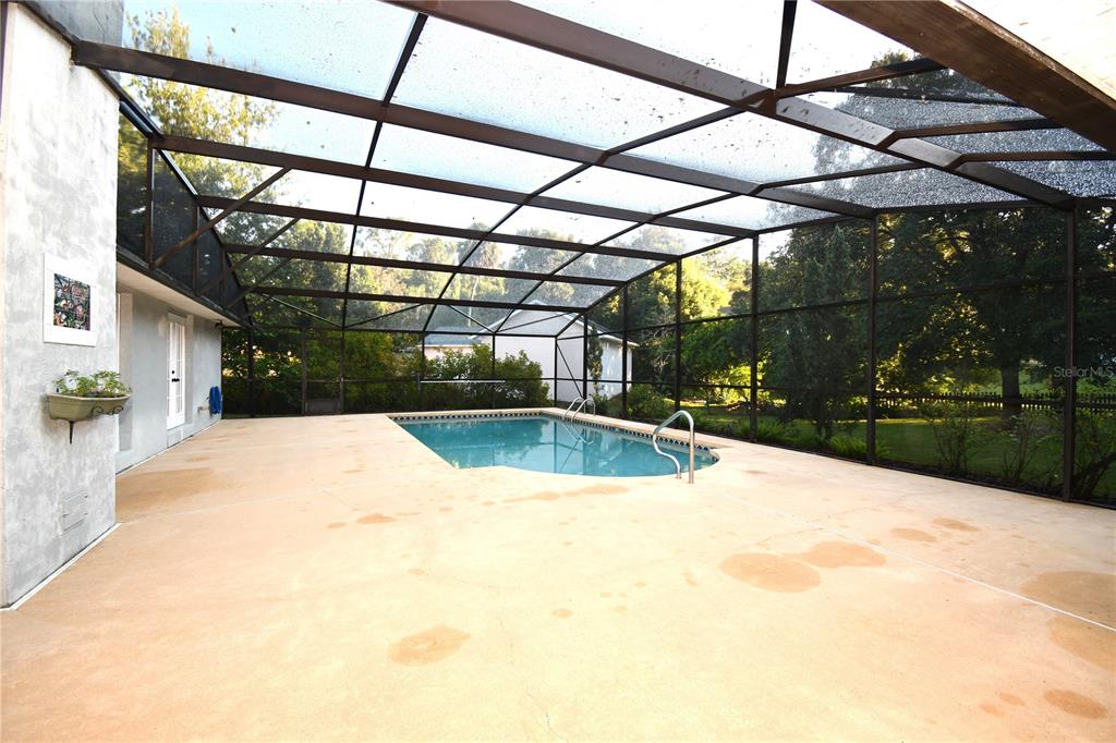 611 Old Eustis Road Mount Dora, FL 32757 - Photo 34 of 45 a view of a swimming pool with a patio