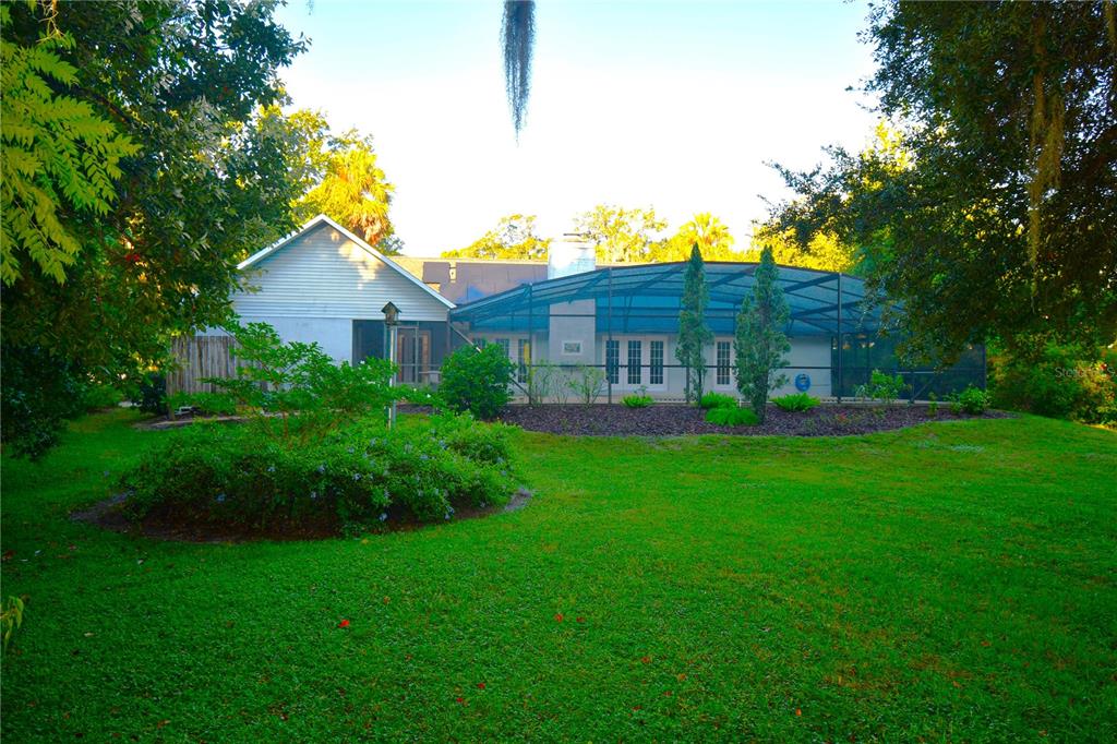611 Old Eustis Road Mount Dora, FL 32757 - Photo 43 of 45 a view of a house with a big yard potted plants and large tree