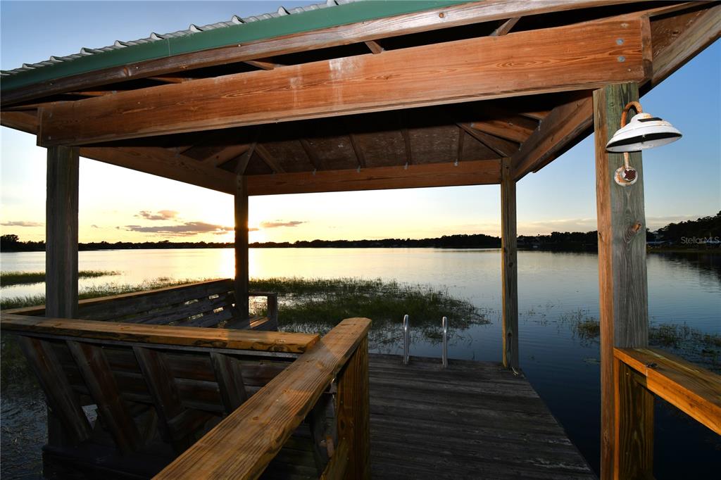 611 Old Eustis Road Mount Dora, FL 32757 - Photo 10 of 45 a view of balcony with wooden floor and outdoor seating