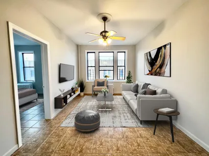 a living room with furniture and a flat screen tv