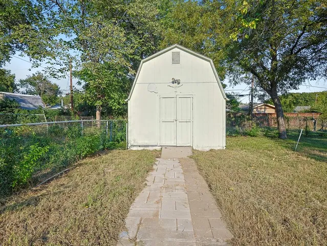 a view of backyard with large trees