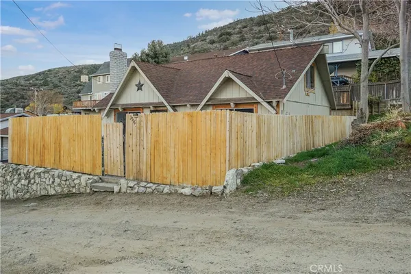a view of barn with wooden fence