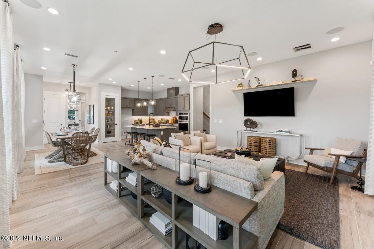 68 Liberty Bell Road Ponte Vedra, FL 32081 - Photo 3 of 8 a living room with fireplace furniture and a flat screen tv