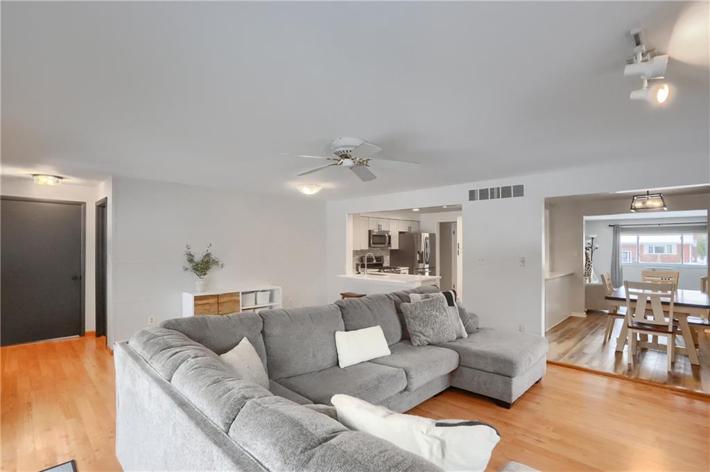 9652 Shirley Drive Allison Park, PA 15101 - Photo 24 of 49 a living room with furniture and a large mirror with wooden floor