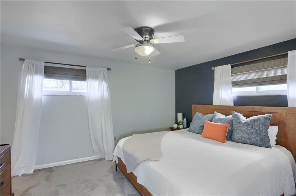 9652 Shirley Drive Allison Park, PA 15101 - Photo 30 of 49 a bedroom with a large bed and a chandelier