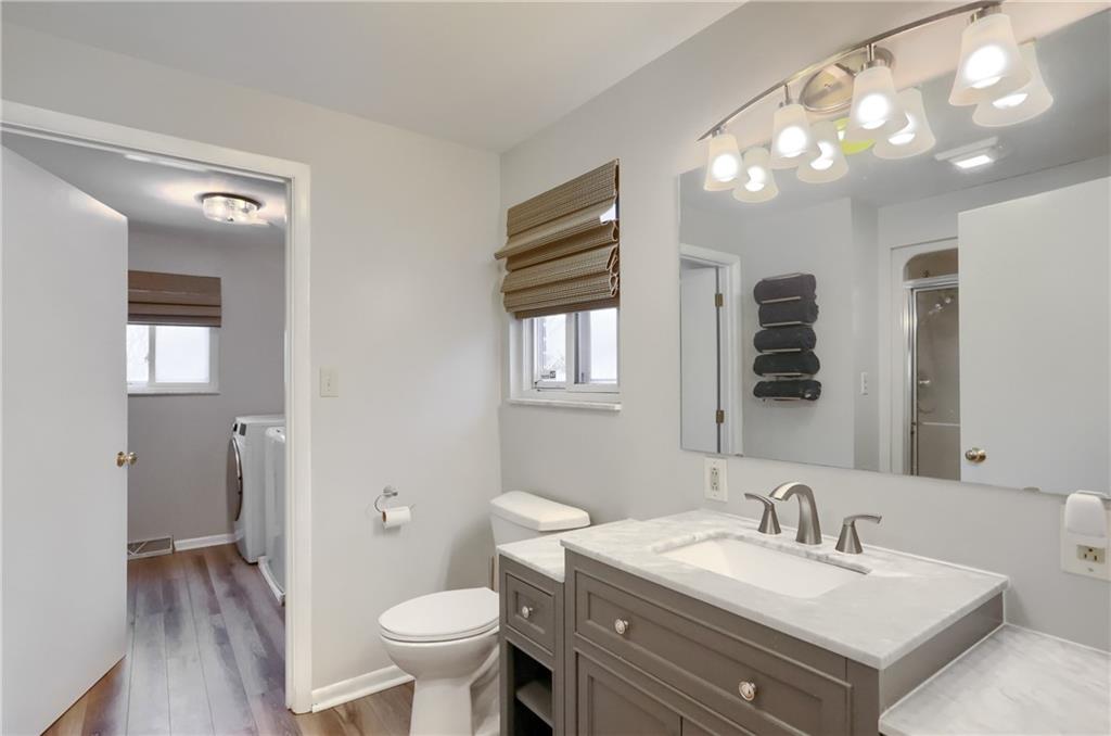 9652 Shirley Drive Allison Park, PA 15101 - Photo 34 of 49 a bathroom with a sink vanity mirror and toilet