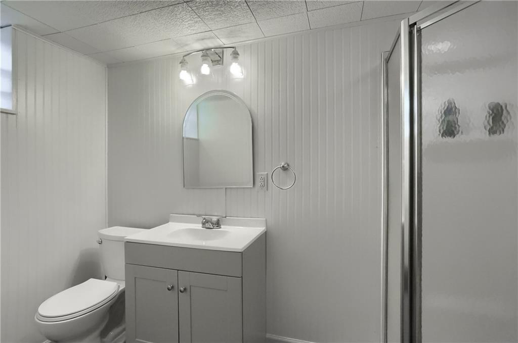 9652 Shirley Drive Allison Park, PA 15101 - Photo 44 of 49 a bathroom with a toilet sink and mirror