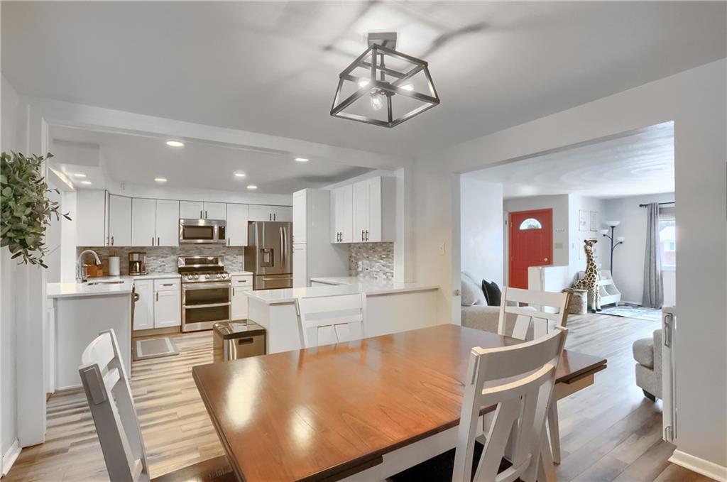 9652 Shirley Drive Allison Park, PA 15101 - Photo 10 of 49 a large kitchen with a table and chairs in it