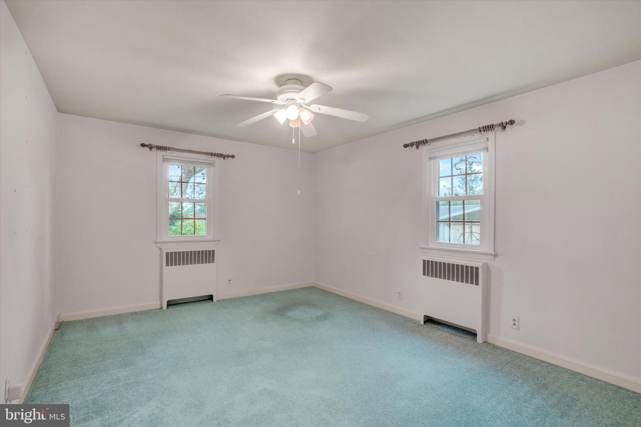 398 Edgehill Road York, PA 17403 - Photo 15 of 28 an empty room with windows and fan