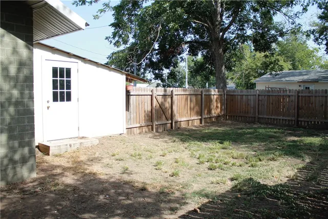 a backyard of a house with lots of green space