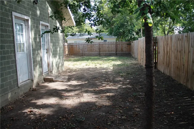 a backyard of a house with lots of green space