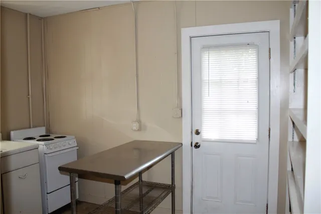 a room that has a window and a table in it