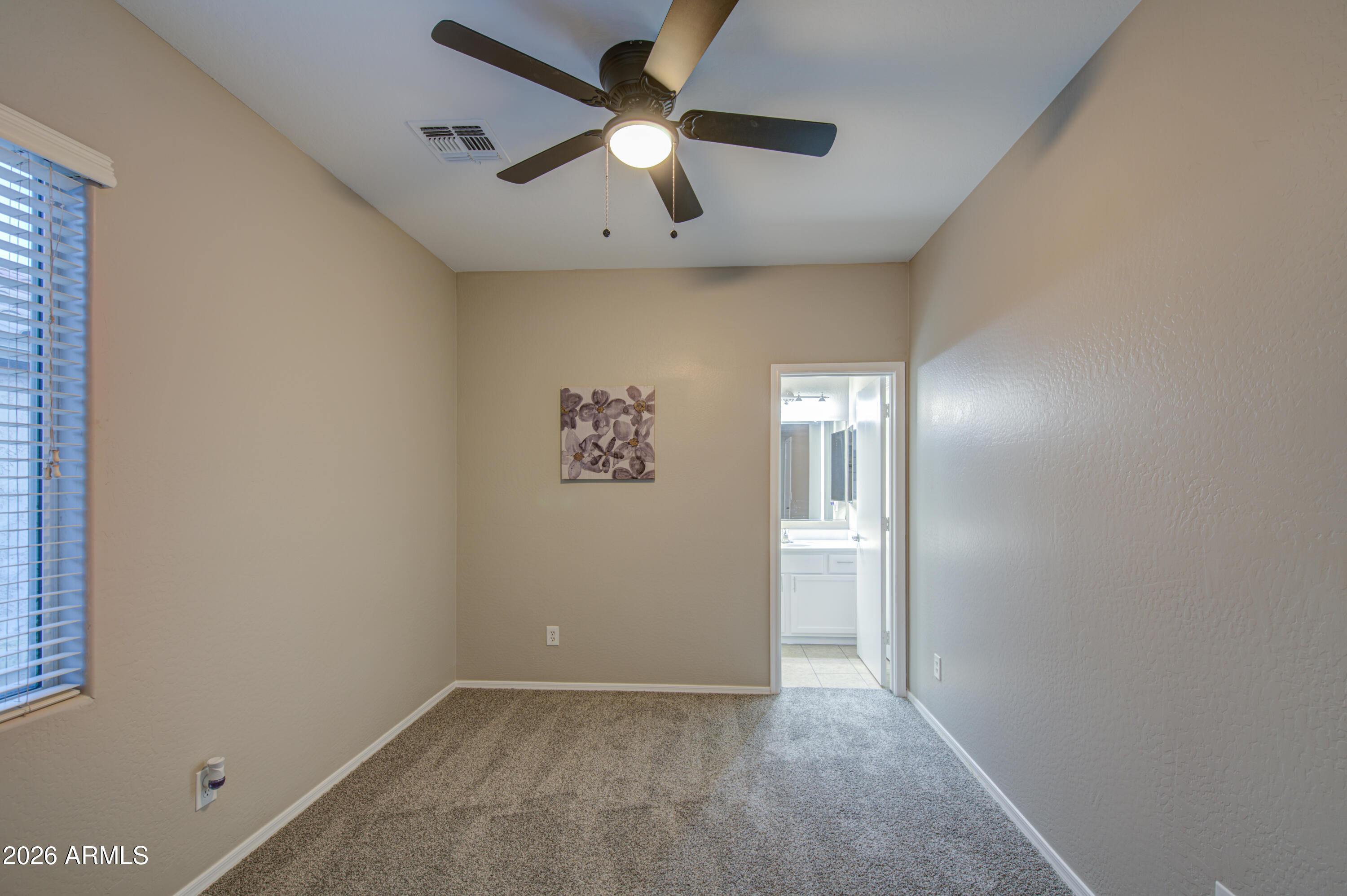 7759 West Monte Vista Road Phoenix, AZ 85035 - Photo 31 of 43 an empty room with closet and fan