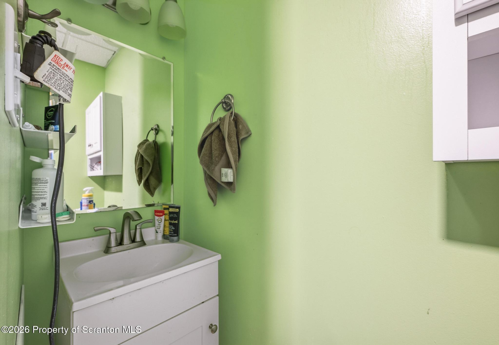 518 Prospect Avenue Scranton, PA 18505 - Photo 34 of 59 a bathroom with a sink and a mirror