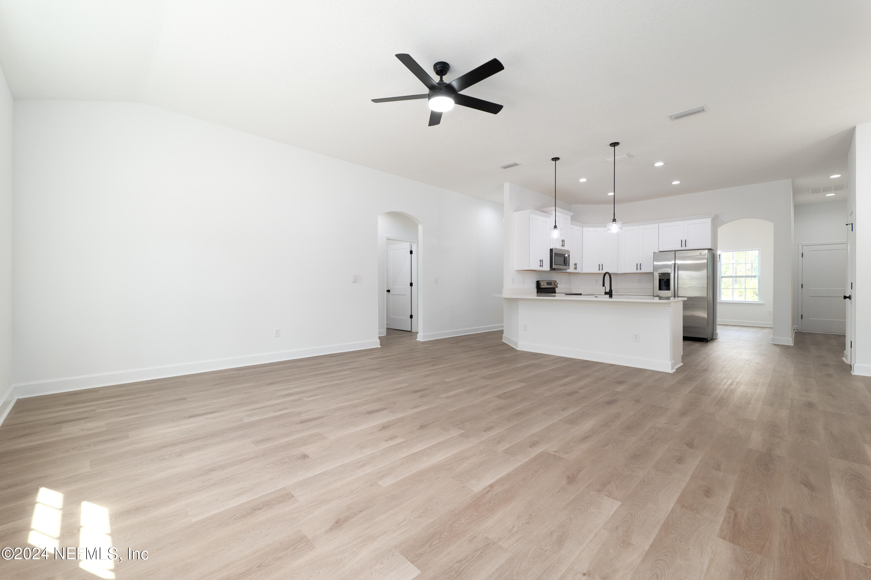 489 Kay Road Middleburg, FL 32068 - Photo 18 of 36 a view of a kitchen with a sink and a window
