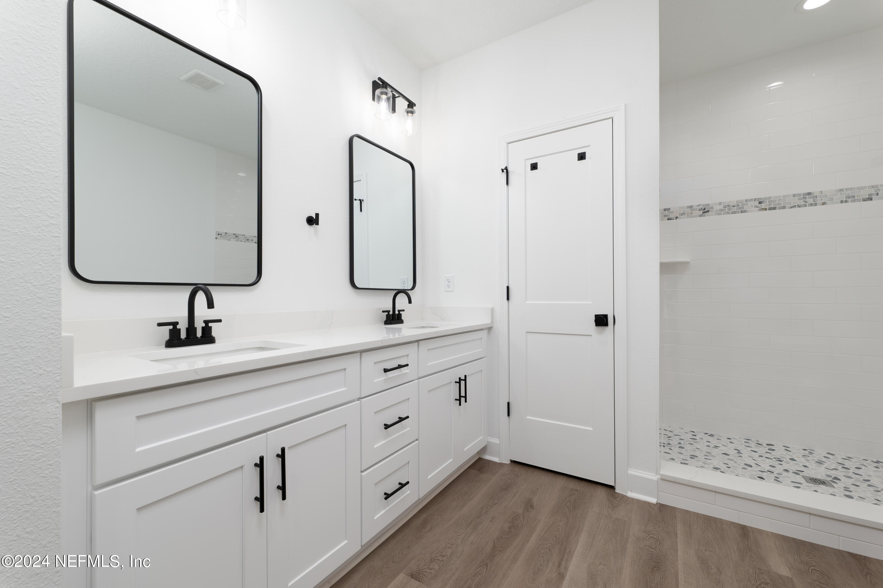 489 Kay Road Middleburg, FL 32068 - Photo 21 of 36 a bathroom with a double vanity sink mirror and