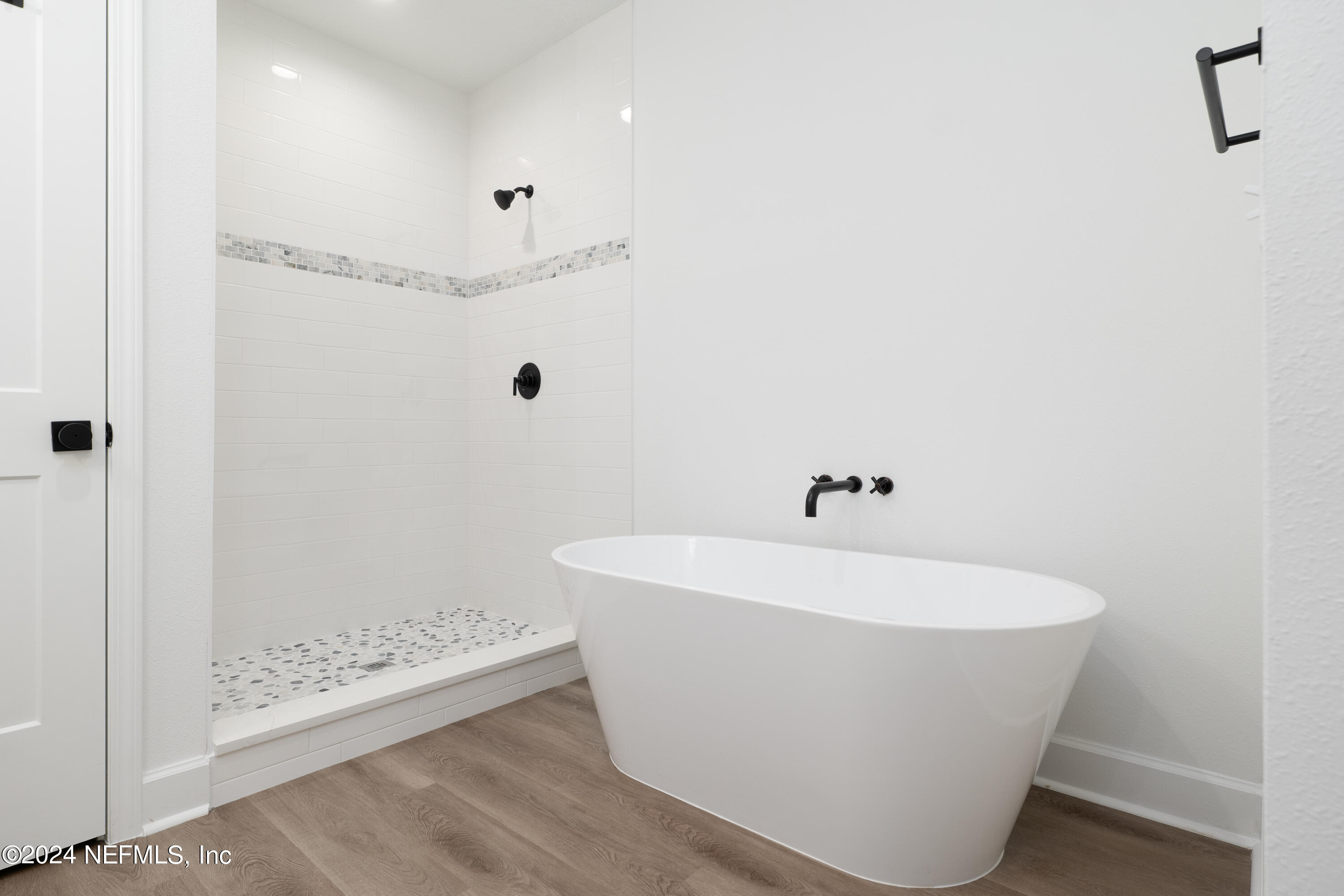 489 Kay Road Middleburg, FL 32068 - Photo 22 of 36 a white bath tub sitting in a bathroom