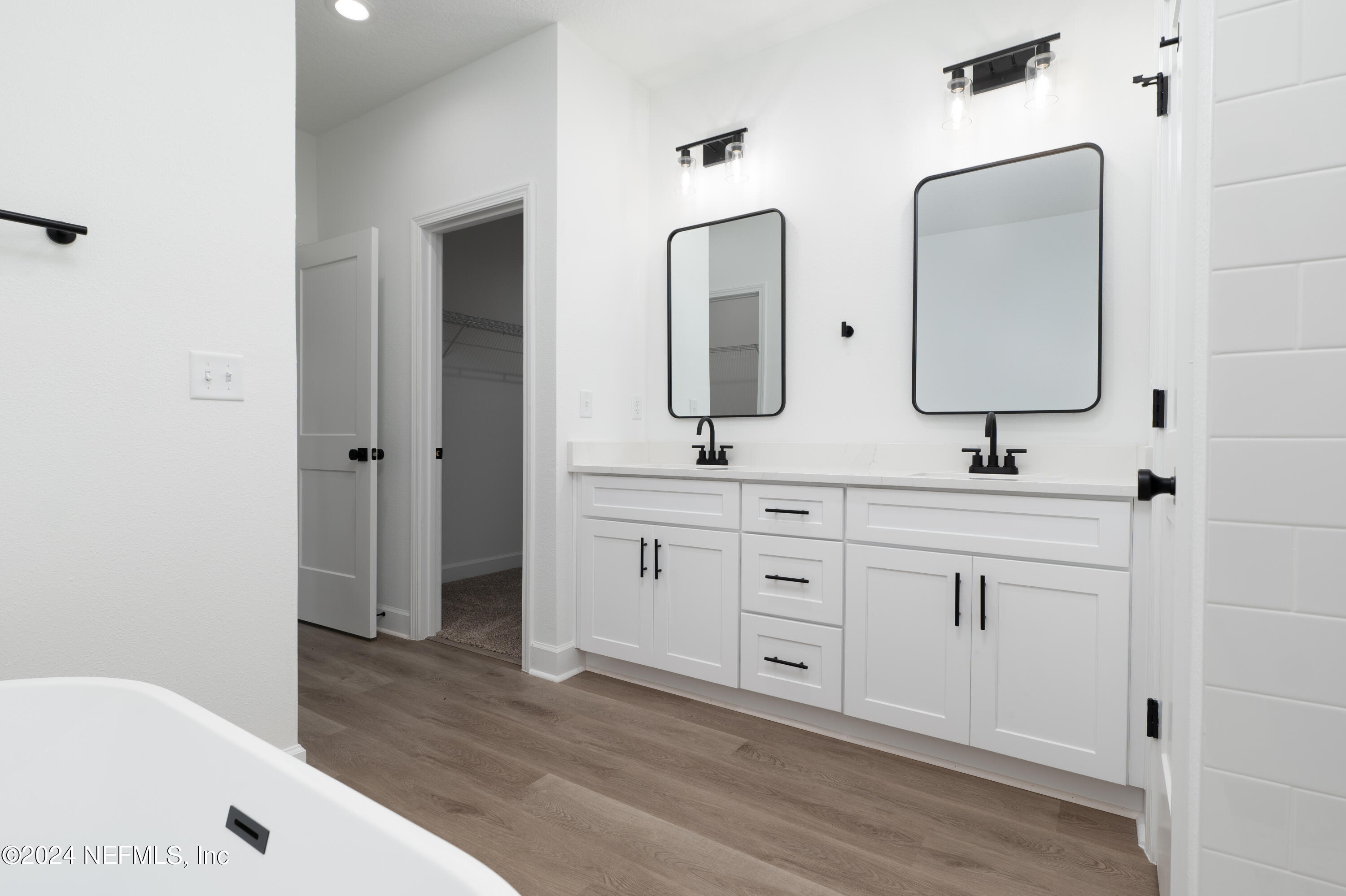 489 Kay Road Middleburg, FL 32068 - Photo 23 of 36 a bathroom with double vanity sink two mirror and a window