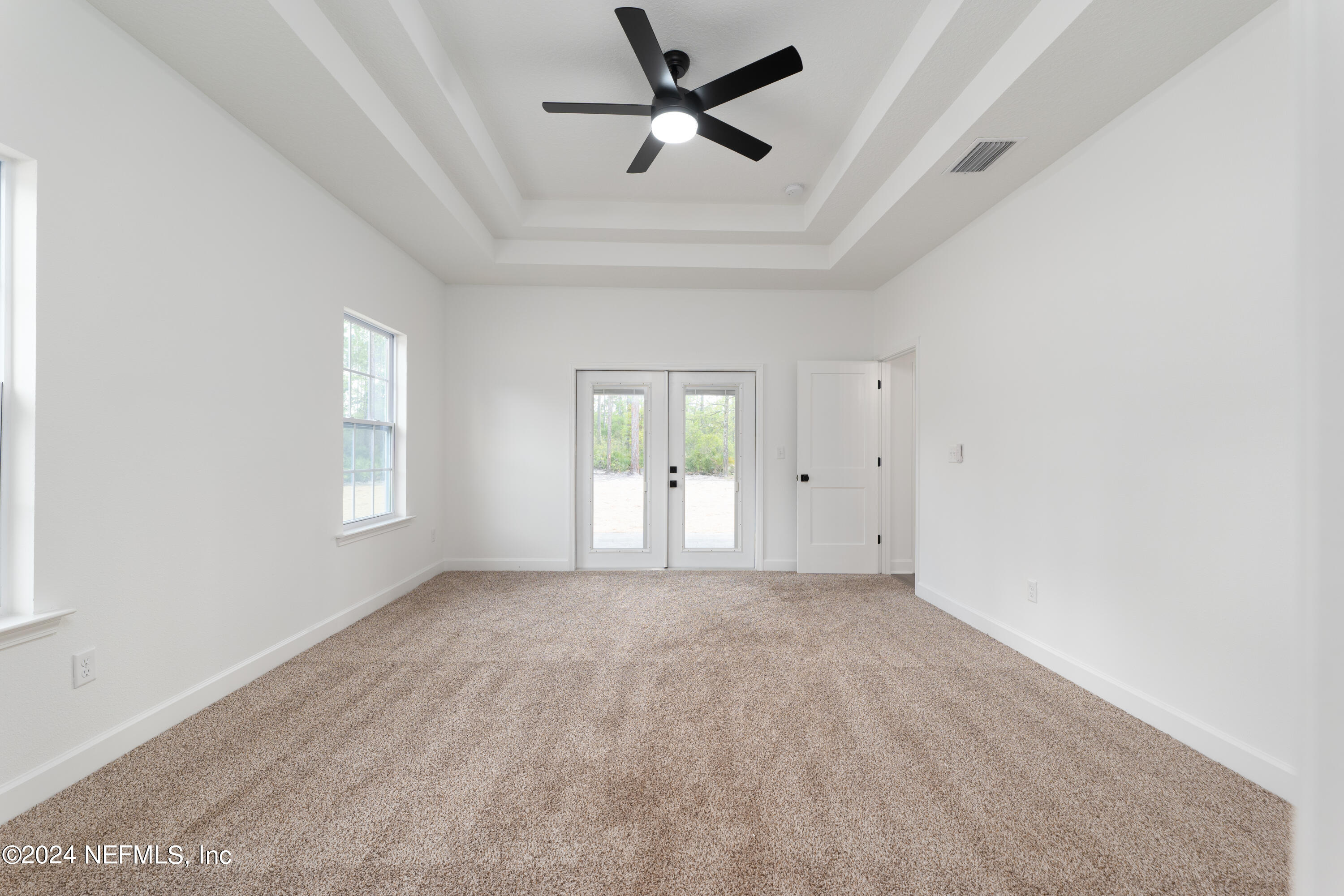 489 Kay Road Middleburg, FL 32068 - Photo 25 of 36 wooden floor in an empty room with a window