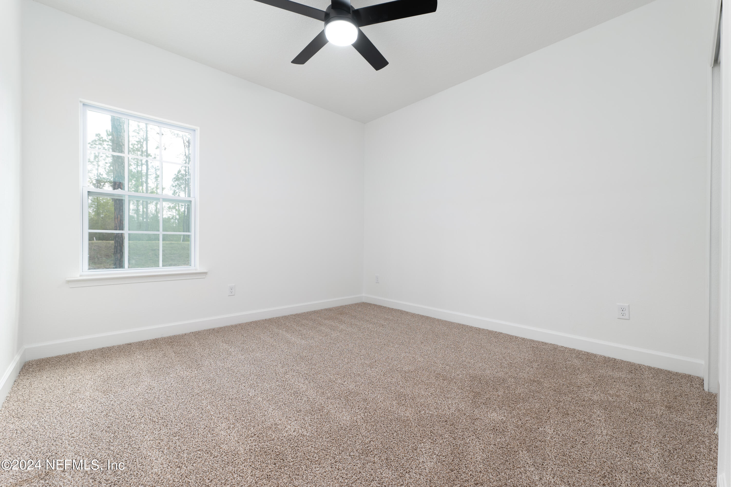 489 Kay Road Middleburg, FL 32068 - Photo 26 of 36 an empty room with a window