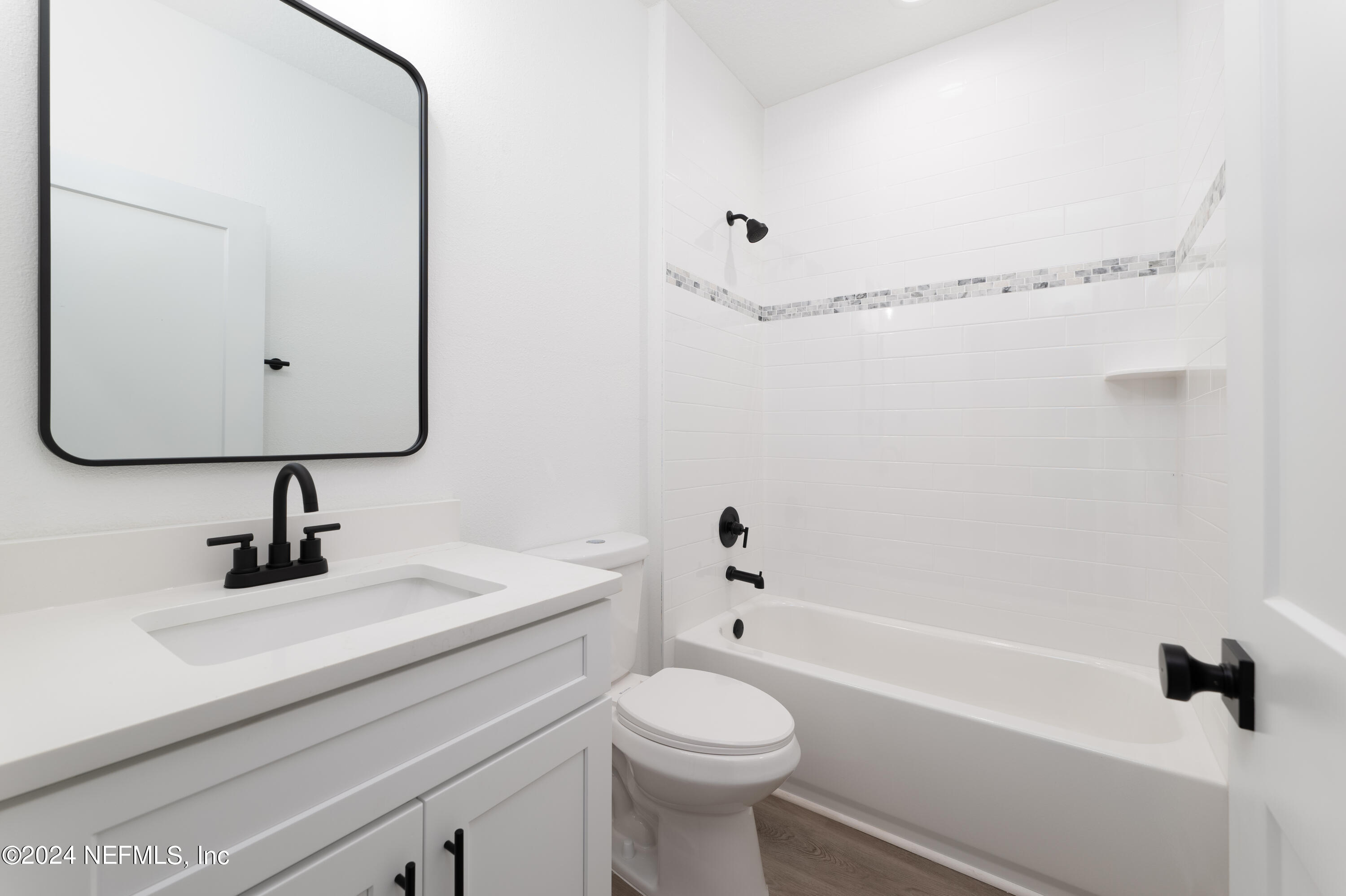 489 Kay Road Middleburg, FL 32068 - Photo 28 of 36 a bathroom with a sink toilet a mirror and shower