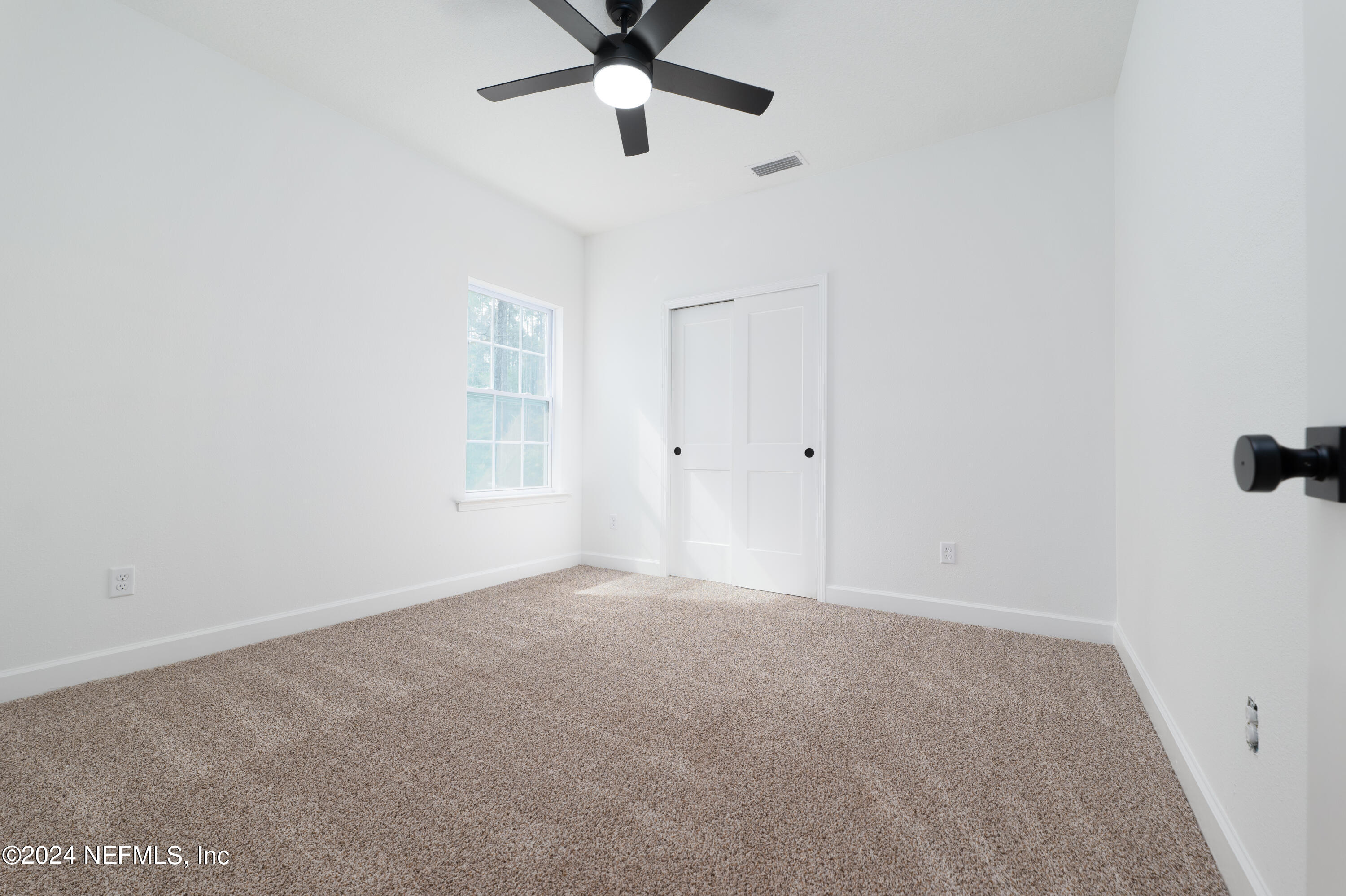 489 Kay Road Middleburg, FL 32068 - Photo 29 of 36 a view of an empty room with a window