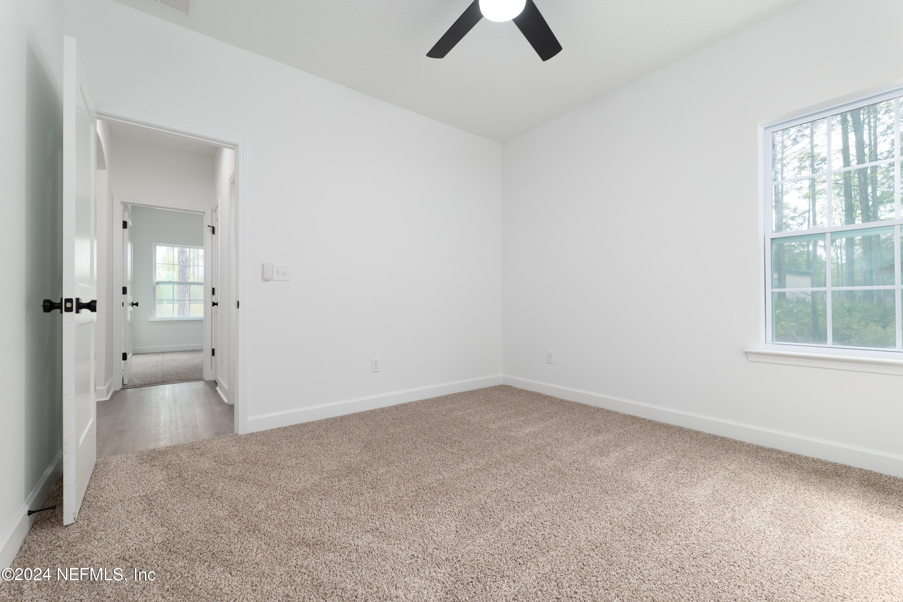 489 Kay Road Middleburg, FL 32068 - Photo 30 of 36 an empty room with closet and windows