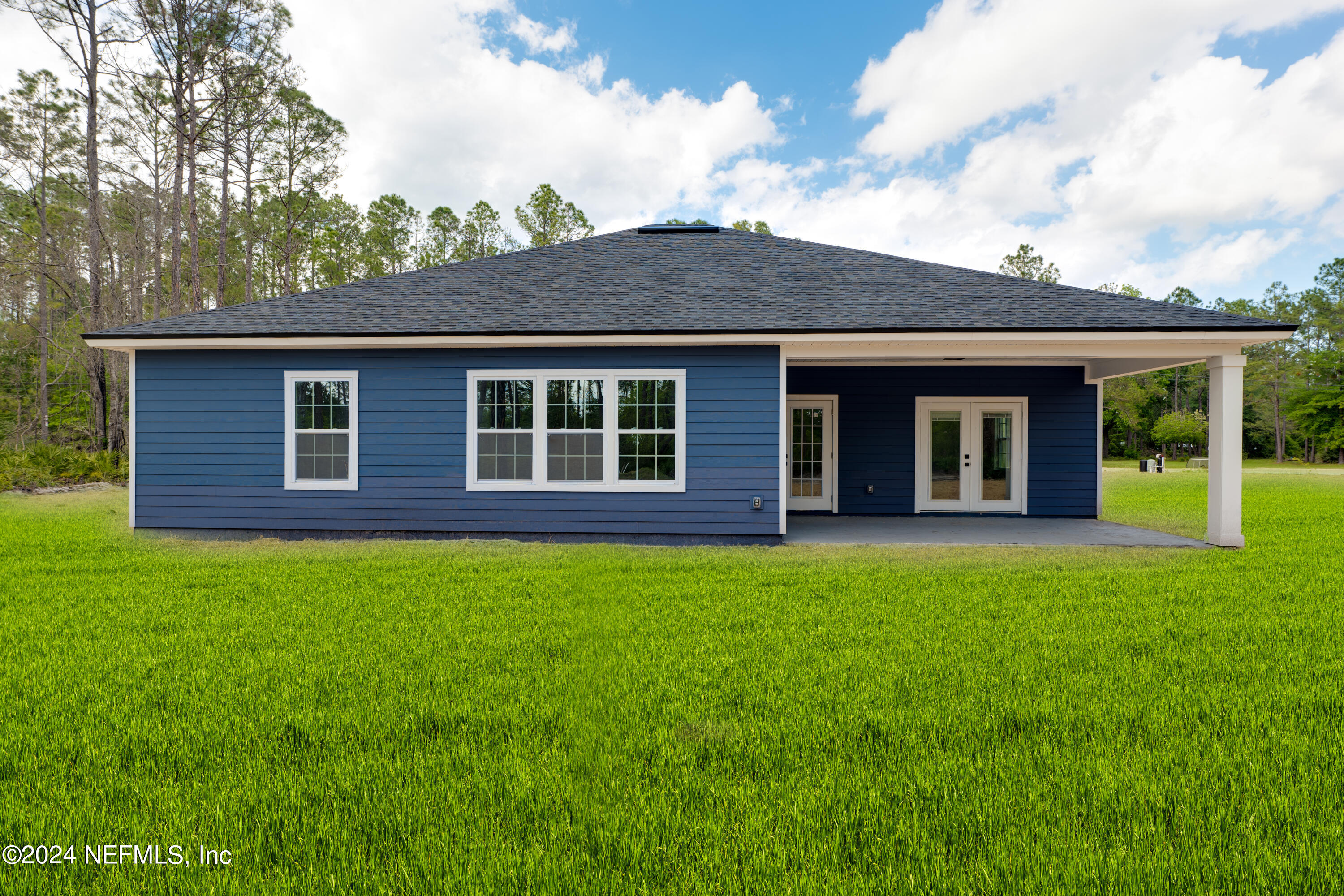 489 Kay Road Middleburg, FL 32068 - Photo 35 of 36 front view of a house with a garden