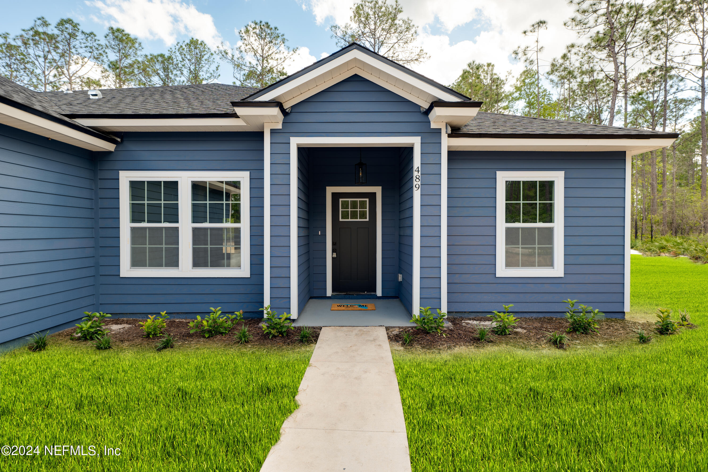 489 Kay Road Middleburg, FL 32068 - Photo 4 of 36 a front view of a house with garden