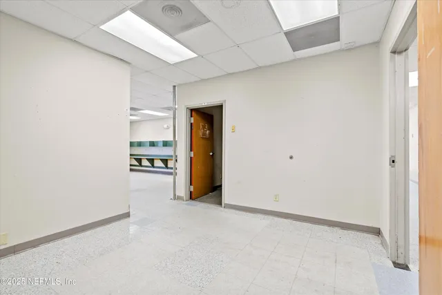 a view of kitchen and refrigerator