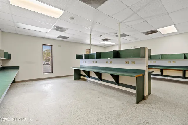 a bedroom with furniture and window