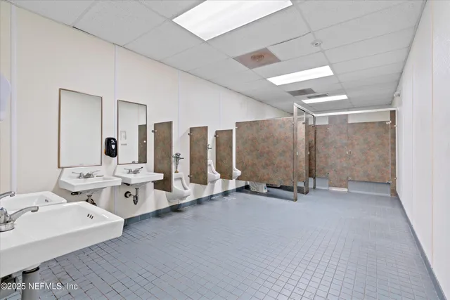 a very nice looking room with a large window and chandelier