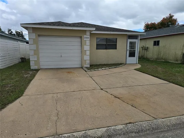 a front view of a house with a garage
