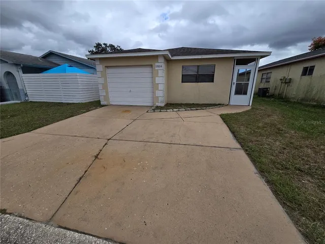 a view of garage and yard