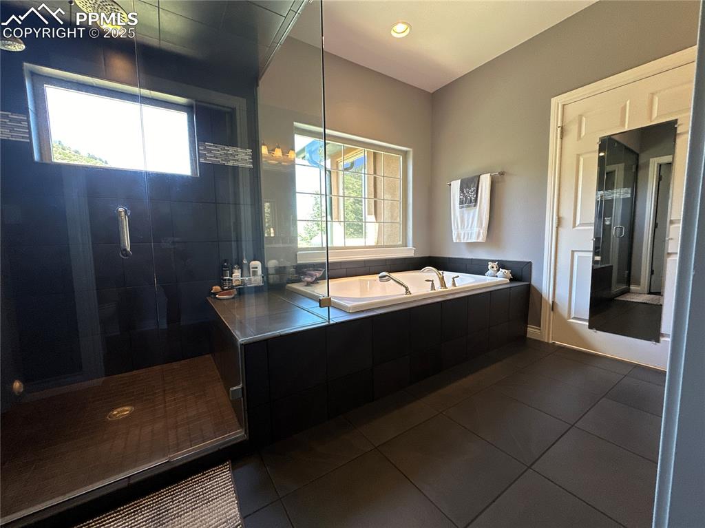 1240 Oak Ridge Road Manitou Springs, CO 80829 - Photo 11 of 17 a bathroom with a bathtub and a sink