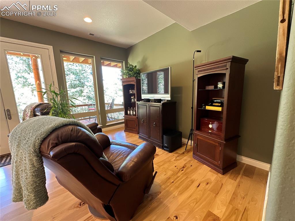 1240 Oak Ridge Road Manitou Springs, CO 80829 - Photo 12 of 17 a living room with stainless steel appliances furniture a rug and a large window