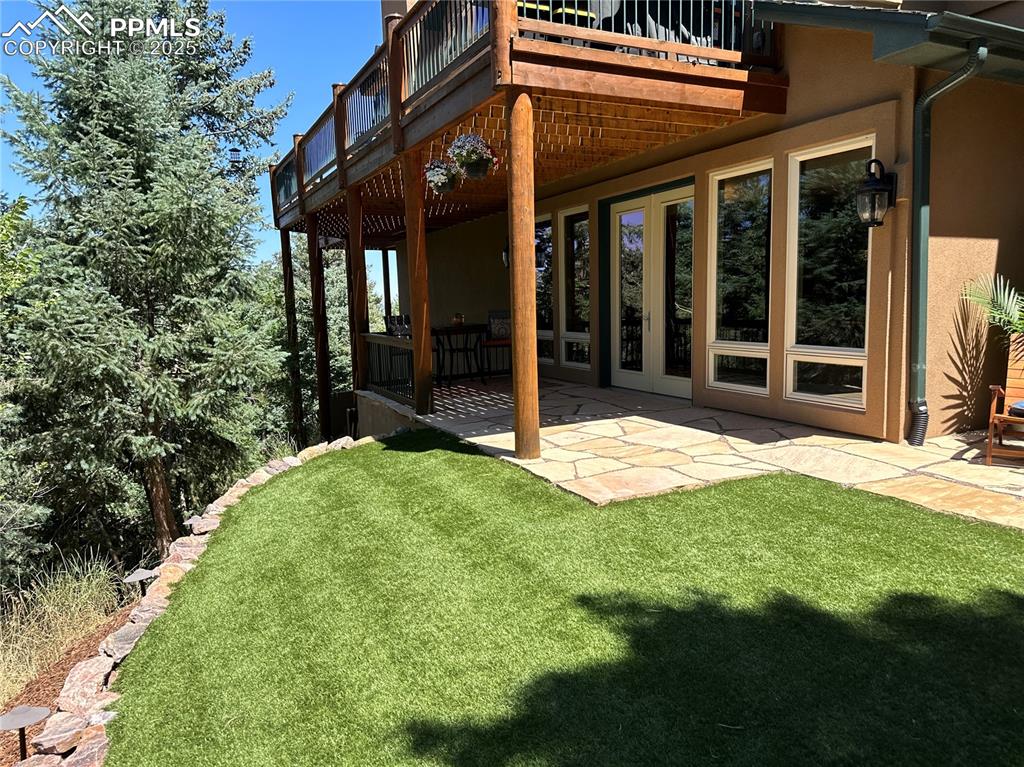 1240 Oak Ridge Road Manitou Springs, CO 80829 - Photo 14 of 17 a view of a house with backyard and porch