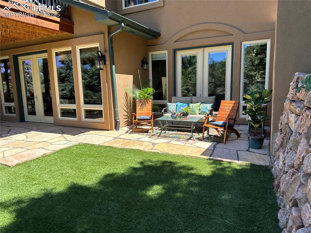 1240 Oak Ridge Road Manitou Springs, CO 80829 - Photo 15 of 17 a view of a house with backyard porch and patio