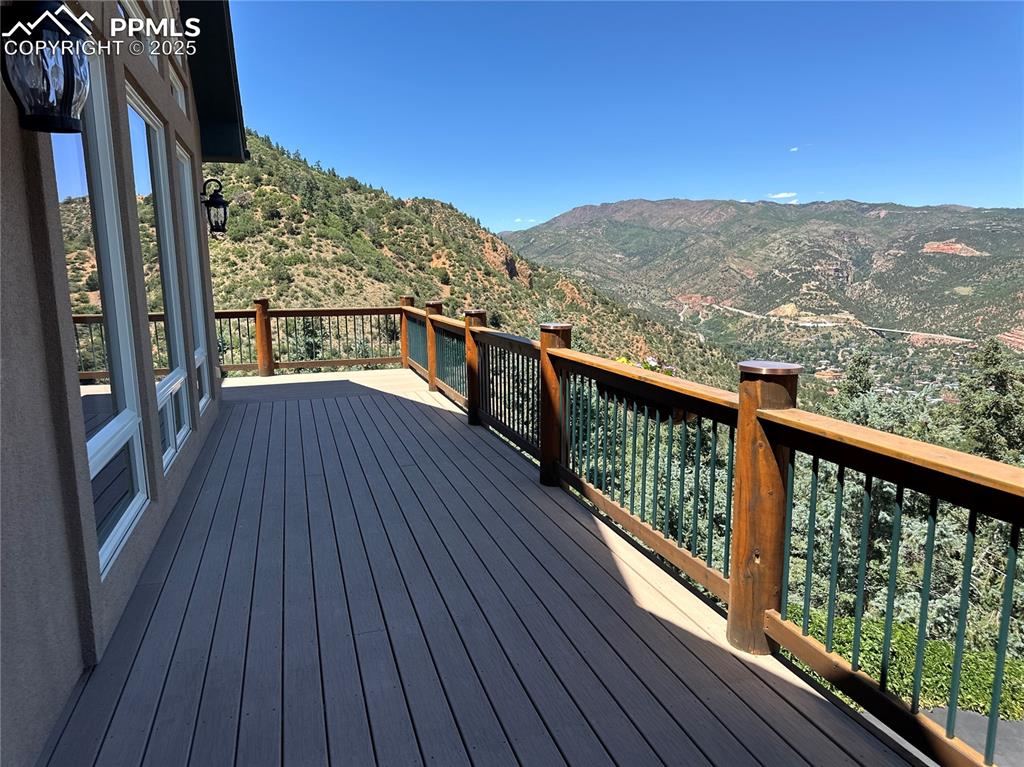 1240 Oak Ridge Road Manitou Springs, CO 80829 - Photo 2 of 17 a view of a balcony with wooden floor and fence