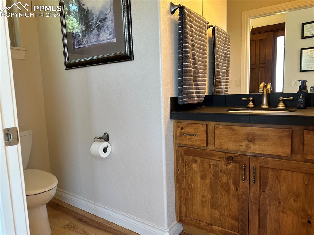 1240 Oak Ridge Road Manitou Springs, CO 80829 - Photo 4 of 17 a bathroom with a granite countertop sink and a mirror