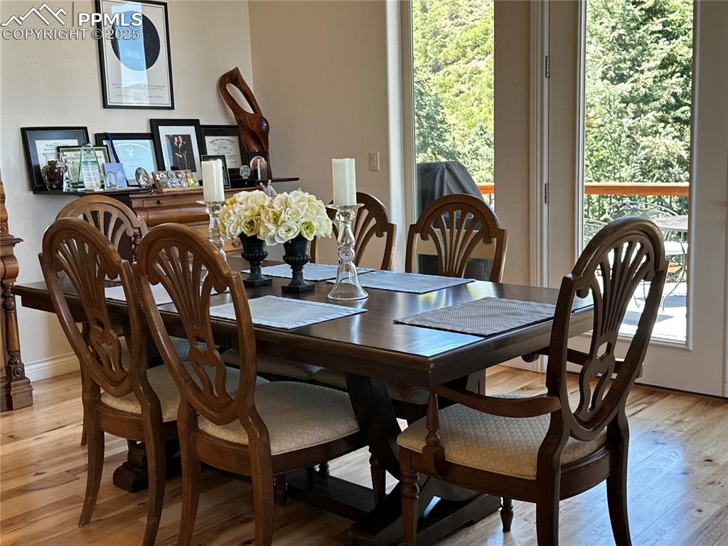 1240 Oak Ridge Road Manitou Springs, CO 80829 - Photo 7 of 17 a view of a dining room with furniture and chandelier