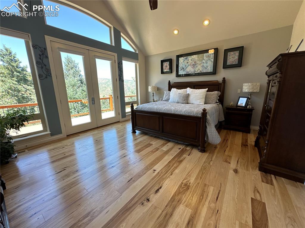 1240 Oak Ridge Road Manitou Springs, CO 80829 - Photo 10 of 17 a spacious bedroom with a bed and wooden floor